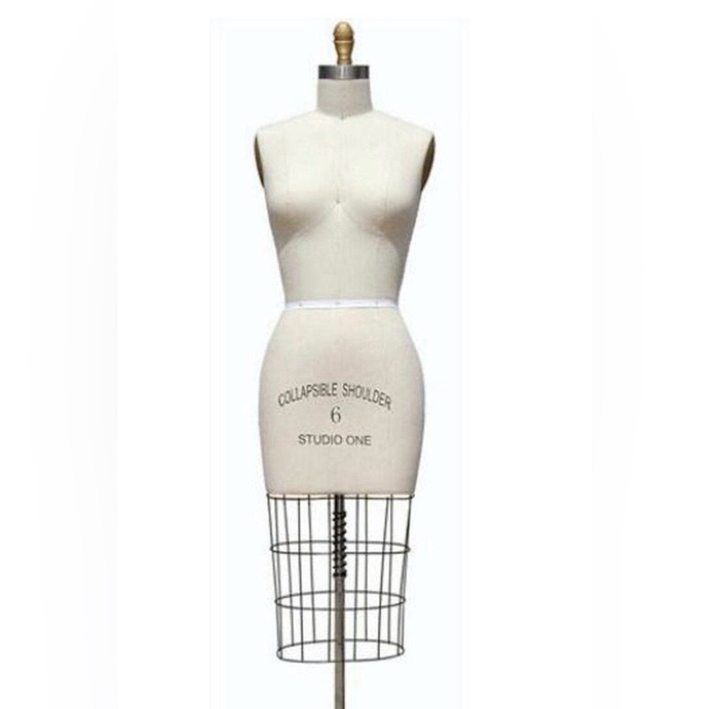 A design maniquin that is adjustable on wheels. Comes with push pins brand new.